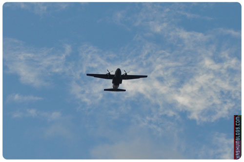 Passing by of the first plane, while president of Seychelles arrives. Nobody cares about him, everyone looking high up in the sky