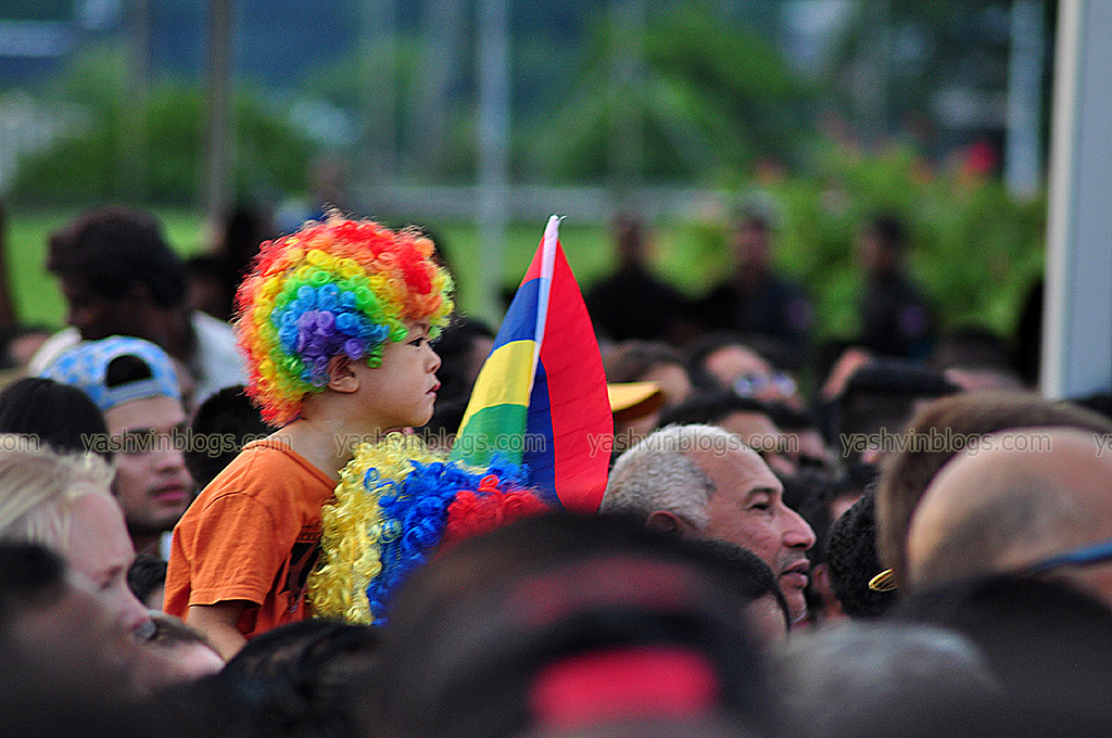 The kid with his flag and colored wig...