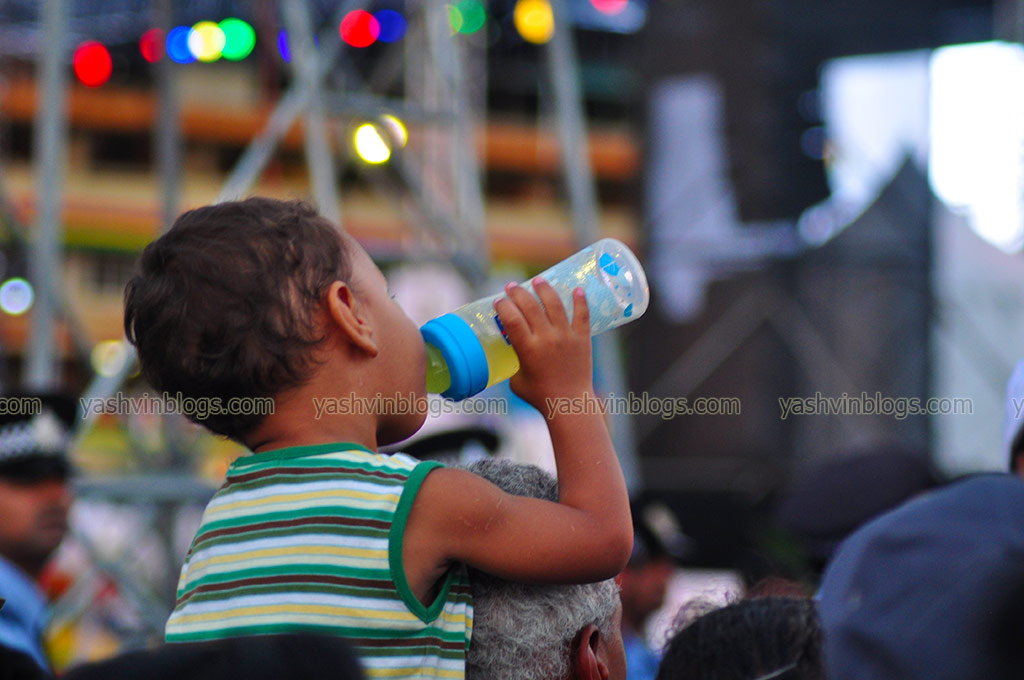 A kid with his feeding bottle